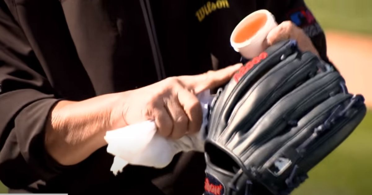 oiling a baseball mitt